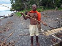 Tomas Taleo Kreno holds a fishing spear.